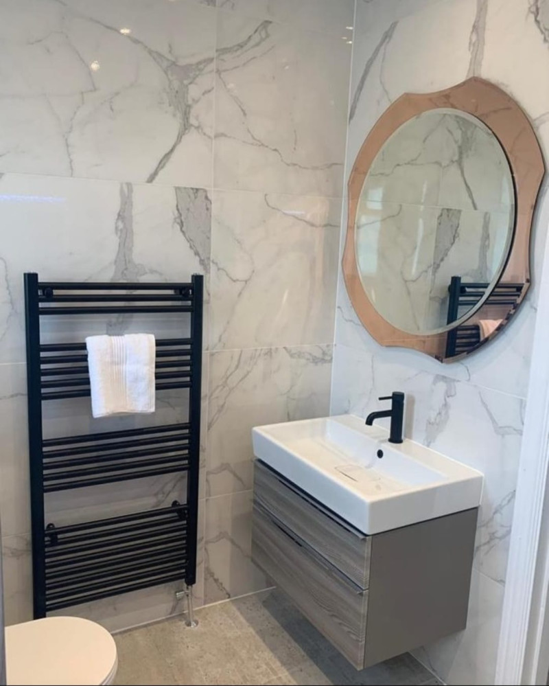 Black slate effect tray with 600x1200 Carrara porcelain tile, black dual function concealed Vale, 800 wall hung unit and matching tall boy fitted in bathroom renovation project in Templeogue, Dublin by A&R Bathrooms